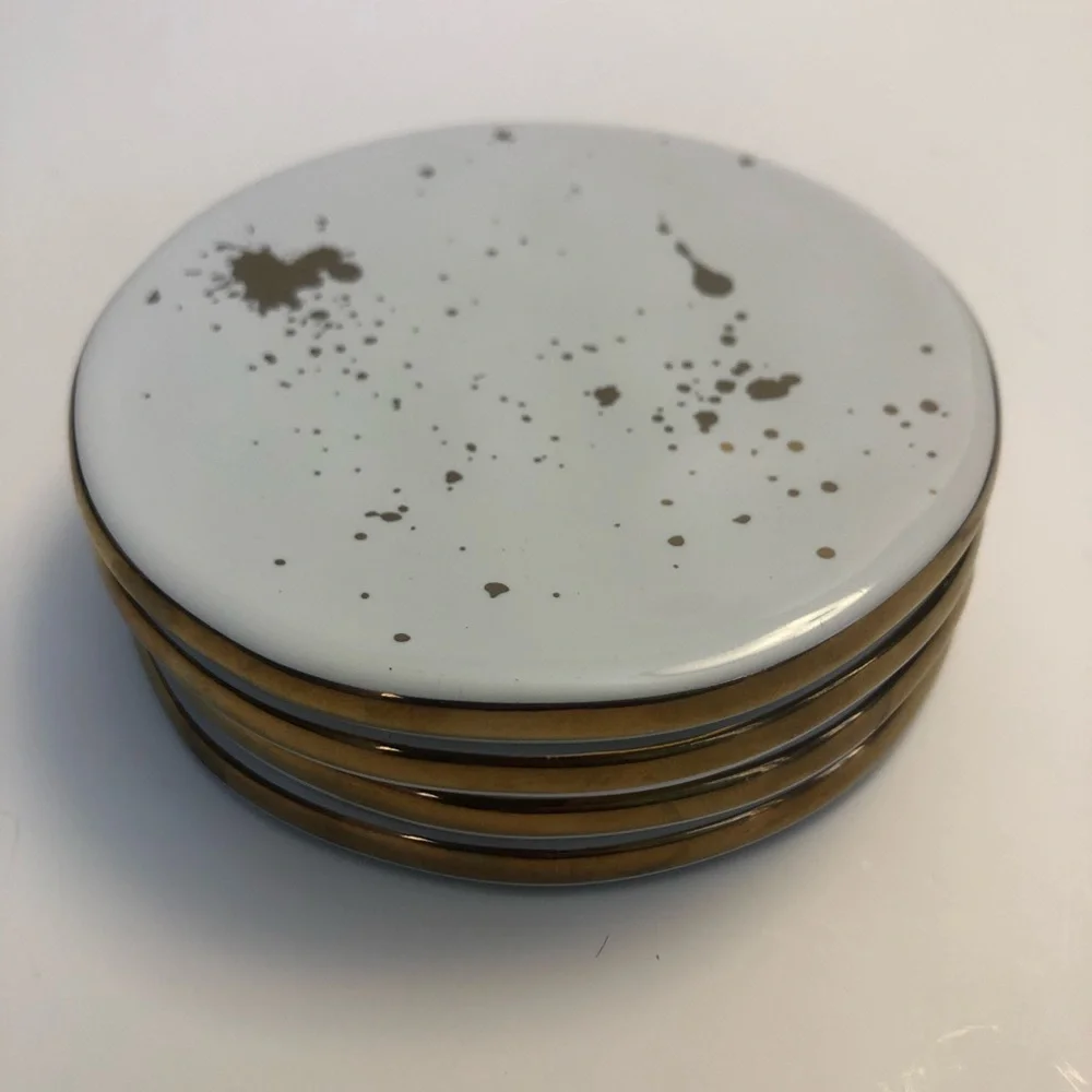 Ceramic coasters with gold trim and gold flecks